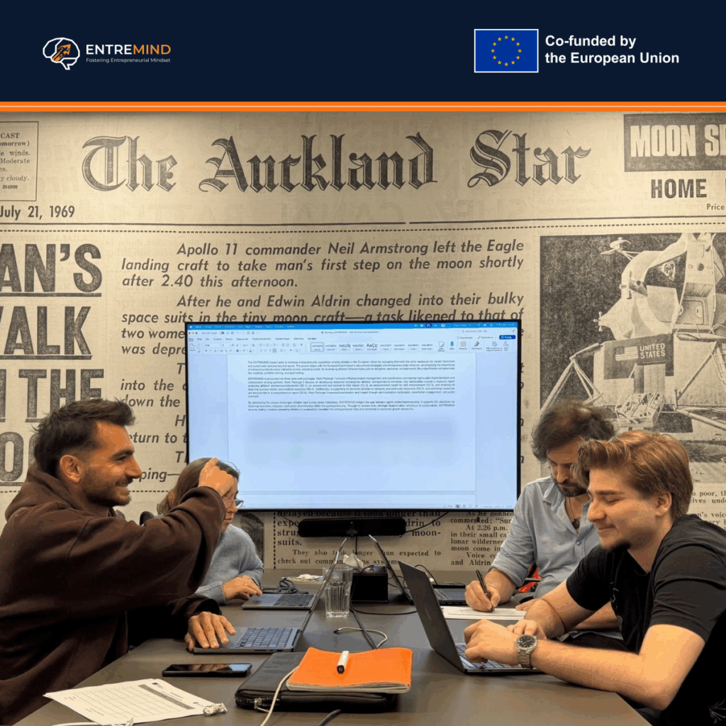 Partner representatives at work around a shared table during the ENTREMIND kick-off meeting in Warsaw.