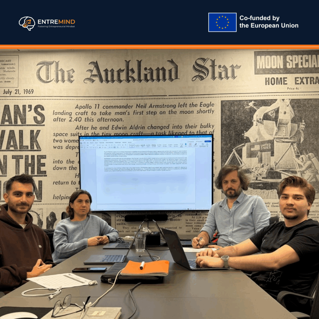 Four partner representatives seated around a meeting table at CIC Warsaw during the ENTREMIND kick-off meeting.